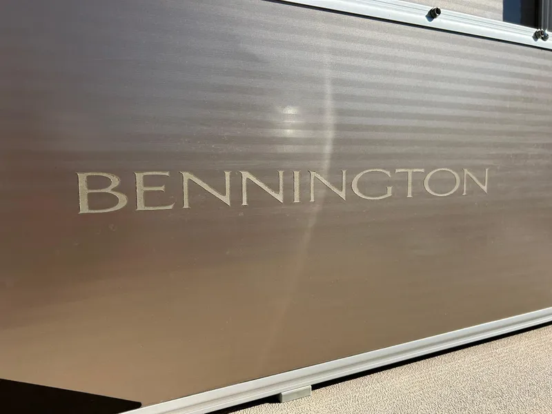 Slide: The Image of 2012 Bennington 20SLi boat side panel with logo in sunlight. - 13