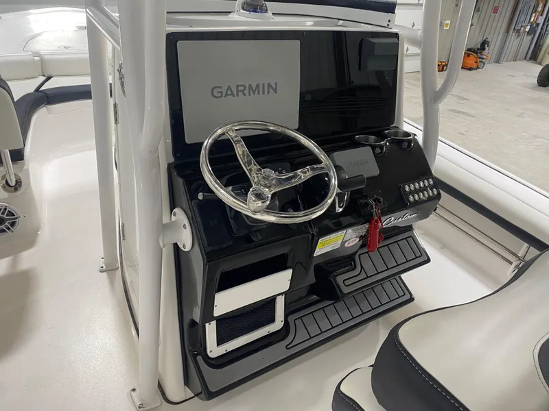 Slide: The Image of 2022 Tidewater 2500 Carolina Bay boat console with Garmin navigation system. - 6
