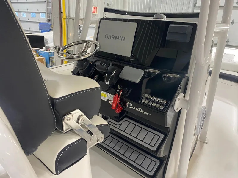 Slide: The Image of 2022 Tidewater 2500 Carolina Bay boat console with Garmin navigation system. - 7