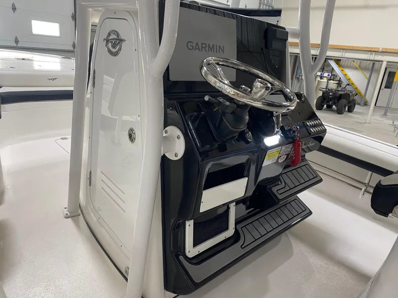 Slide: The Image of 2022 Tidewater 2500 Carolina Bay boat console with Garmin navigation system. - 8