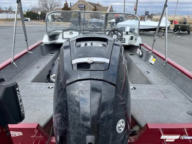 Slide: The Image of 2018 Tracker Pro Guide V-175 WT boat with Mercury 115 engine, parked outdoors. - 10