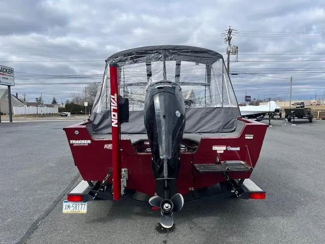 Slide: The Image of 2018 Tracker Pro Guide V-175 WT boat with outboard motor, parked on a trailer. - 12
