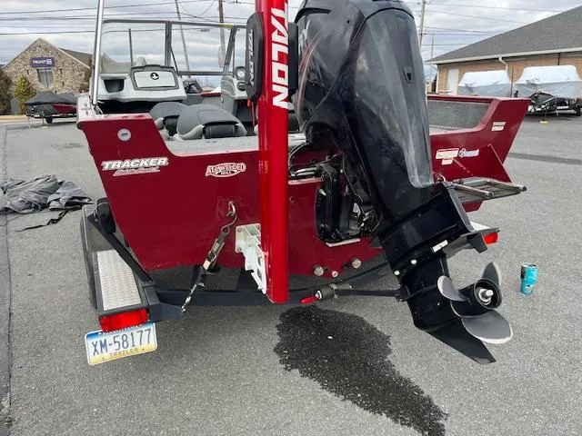 Slide: The Image of 2018 Tracker Pro Guide V-175 WT boat with outboard motor in parking lot. - 13
