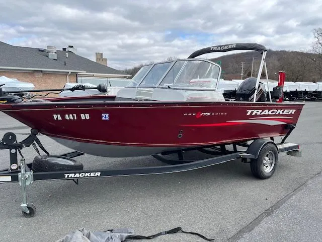 Slide: The Image of 2018 Tracker Pro Guide V-175 WT boat on trailer, parked outdoors. - 4