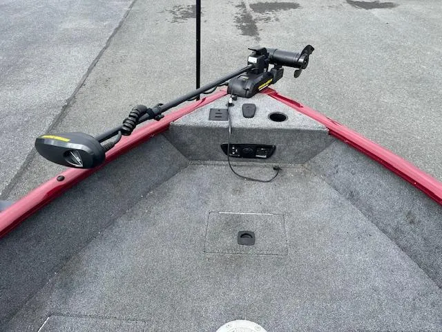 Slide: The Image of 2018 Tracker Pro Guide V-175 WT boat interior with trolling motor and carpeted deck. - 6