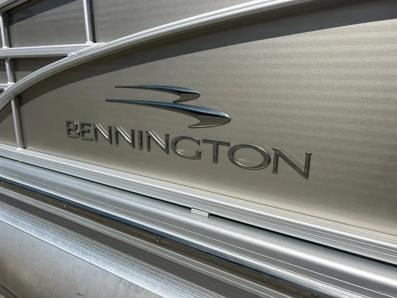 Slide: The Image of Close-up of 2012 Bennington 2250RCL logo on metallic surface. - 1