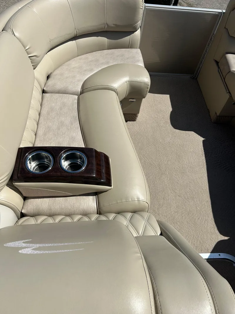 Slide: The Image of Luxurious seating on a 2012 Bennington 2250RCL boat with built-in cup holders. - 13