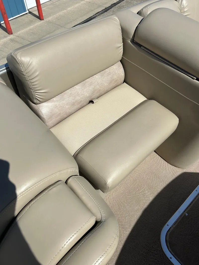 Slide: The Image of 2012 Bennington 2250RCL boat seat with beige upholstery in sunlight. - 14