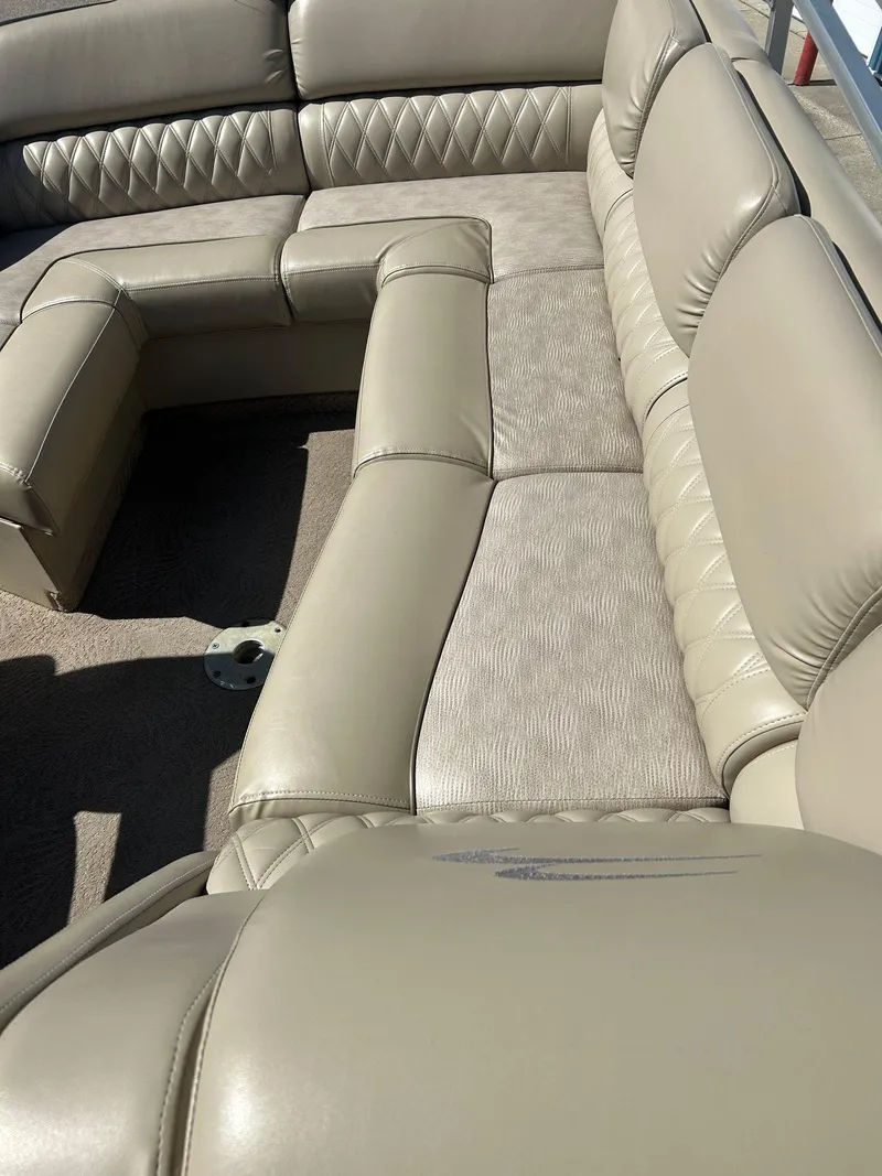 Slide: The Image of 2012 Bennington 2250RCL boat interior with beige leather seating and diamond stitching. - 16