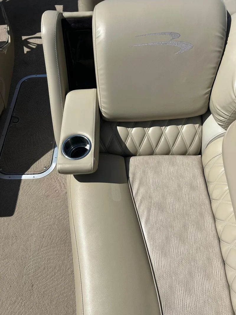 Slide: The Image of Luxurious beige seating with cup holder on 2012 Bennington 2250RCL boat. - 19