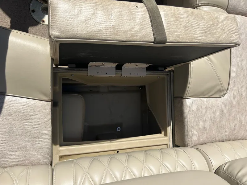 Slide: The Image of Open storage compartment in 2012 Bennington 2250RCL boat seat. - 25