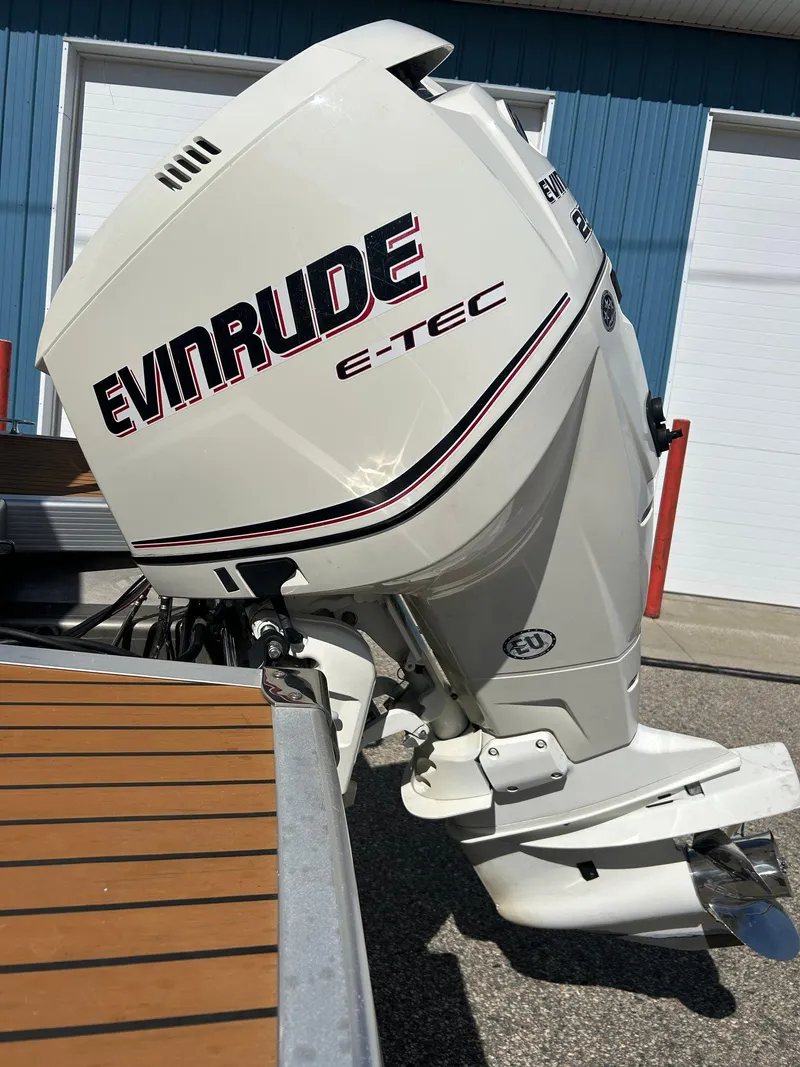 Slide: The Image of Evinrude E-TEC outboard motor on a 2012 Bennington 2250RCL boat. - 38
