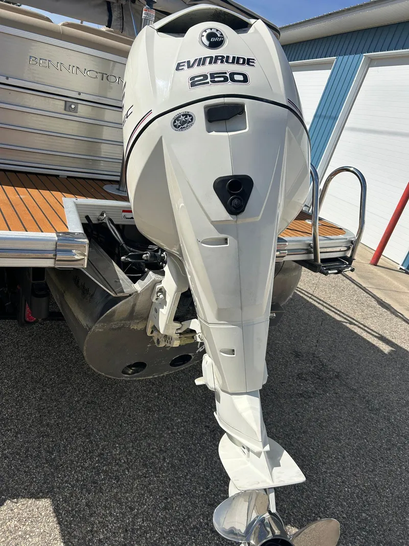 Slide: The Image of 2012 Bennington 2250RCL with Evinrude 250 outboard motor, docked on a sunny day. - 39