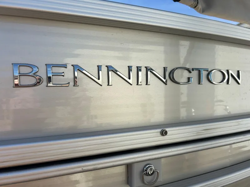 Slide: The Image of 2012 Bennington 2250RCL boat logo on metallic surface. - 40