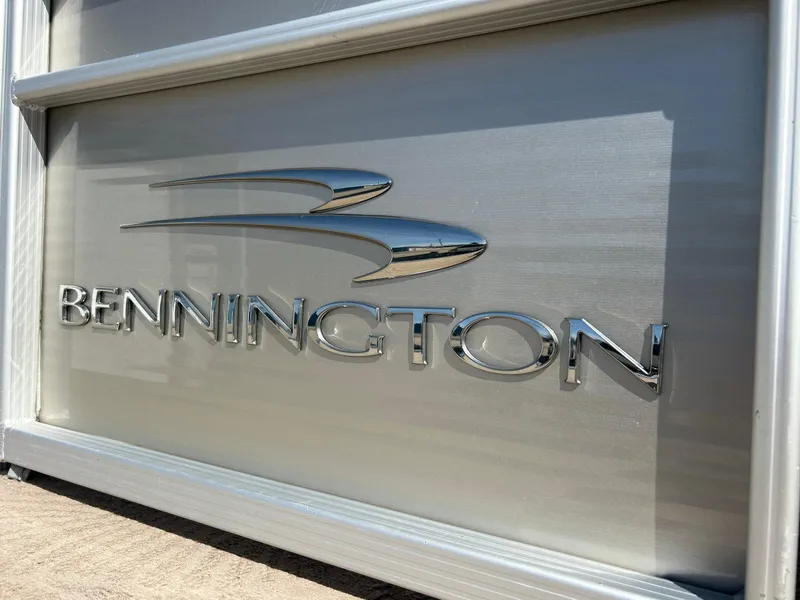 Slide: The Image of Bennington 2250RCL 2012 logo on metallic surface, showcasing sleek design and branding. - 43