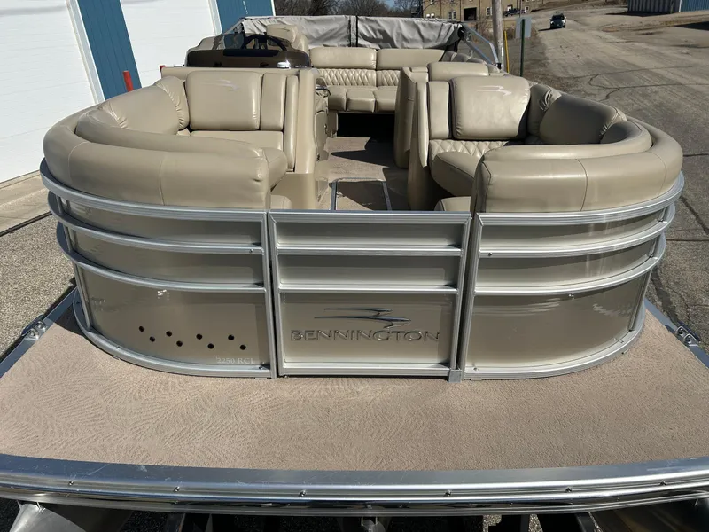 Slide: The Image of 2012 Bennington 2250RCL pontoon boat with beige seating and sleek design. - 45