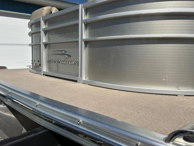 Slide: The Image of 2012 Bennington 2250RCL pontoon boat, silver exterior, close-up view. - 46