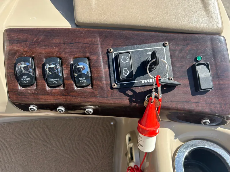 Slide: The Image of Control panel of a 2012 Bennington 2250RCL boat with switches and ignition key. - 6