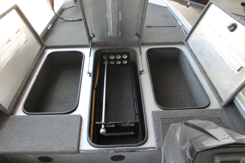 Slide: The Image of 2013 Ranger RT188 boat storage compartments with open lids, showcasing ample space. - 12
