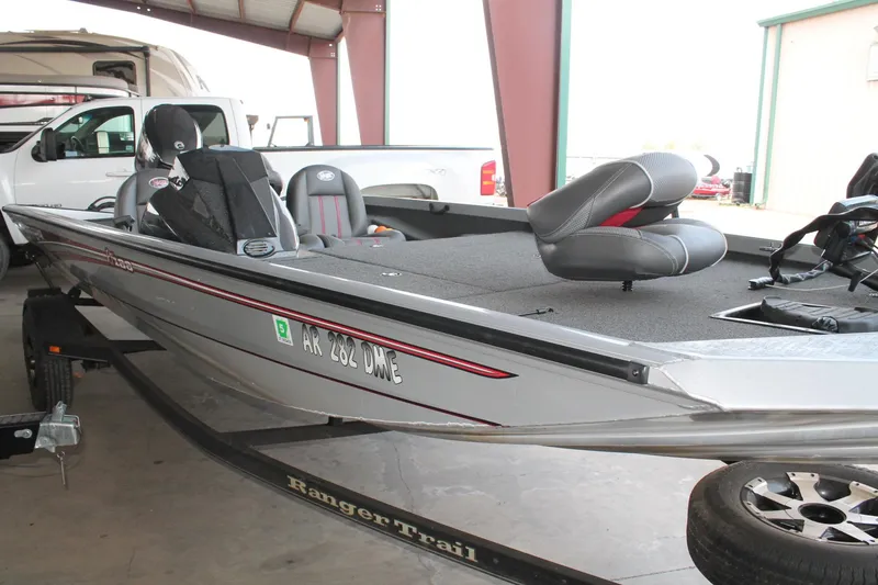 Slide: The Image of 2013 Ranger RT188 boat on trailer in garage, featuring sleek design and comfortable seating. - 5