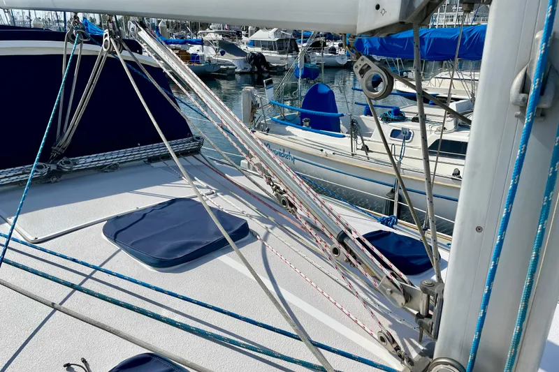 Slide: The Image of Sailboat deck view, Catalina 380, 2001 model, with rigging and marina background. - 12