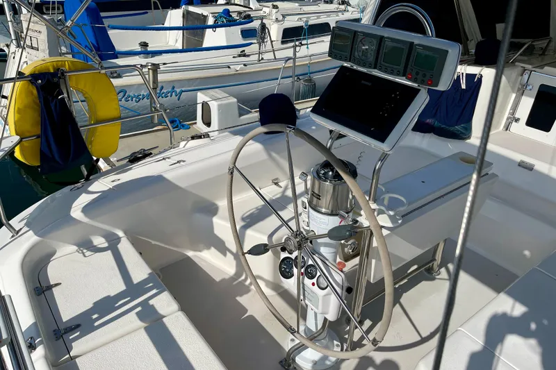 Slide: The Image of Steering wheel and navigation equipment on a 2001 Catalina 380 sailboat. - 16