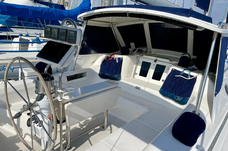 Slide: The Image of Cockpit of a 2001 Catalina 380 sailboat with steering wheel and navigation equipment. - 17
