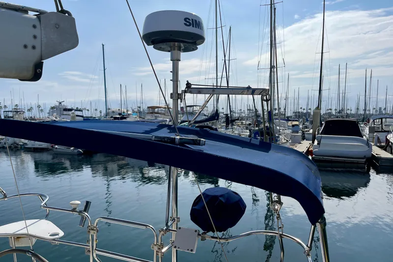 Slide: The Image of Catalina 380 sailboat, 2001 model, docked in a marina with clear skies. - 24