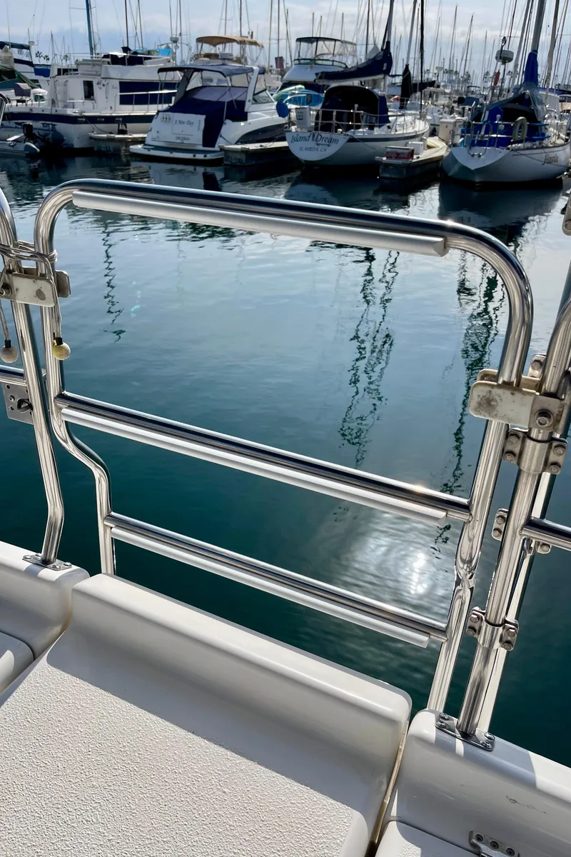 Slide: The Image of Catalina 380 sailboat stern view at marina, 2001 model, with stainless steel railing. - 25