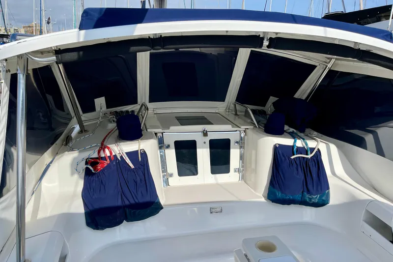 Slide: The Image of Cockpit of 2001 Catalina 380 sailboat with blue covers and seating. - 26