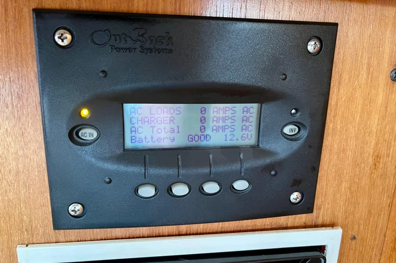 Slide: The Image of Control panel of a 2001 Catalina 380 sailboat, displaying power system status. - 36