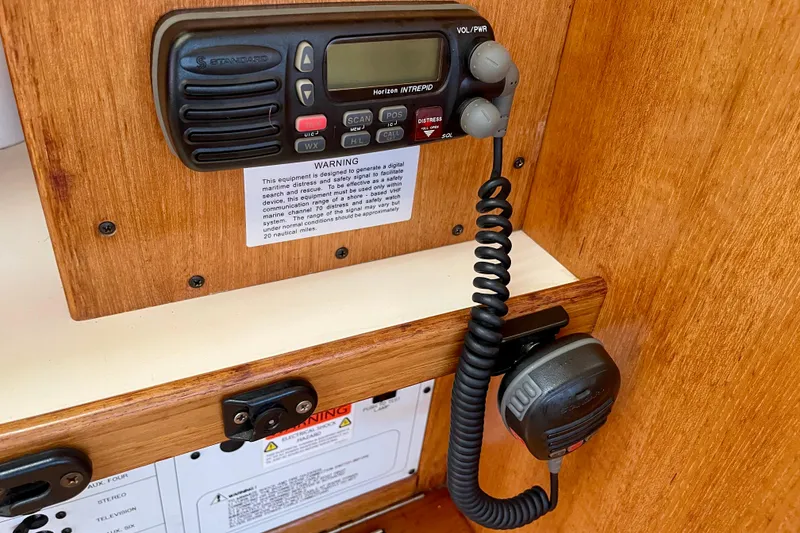 Slide: The Image of VHF radio system on 2001 Catalina 380 sailboat, mounted on wooden panel. - 38