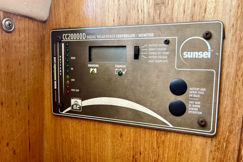 Slide: The Image of Sunsei CC20000D digital solar power controller on Catalina 380, 2001 model, mounted on wooden panel. - 41