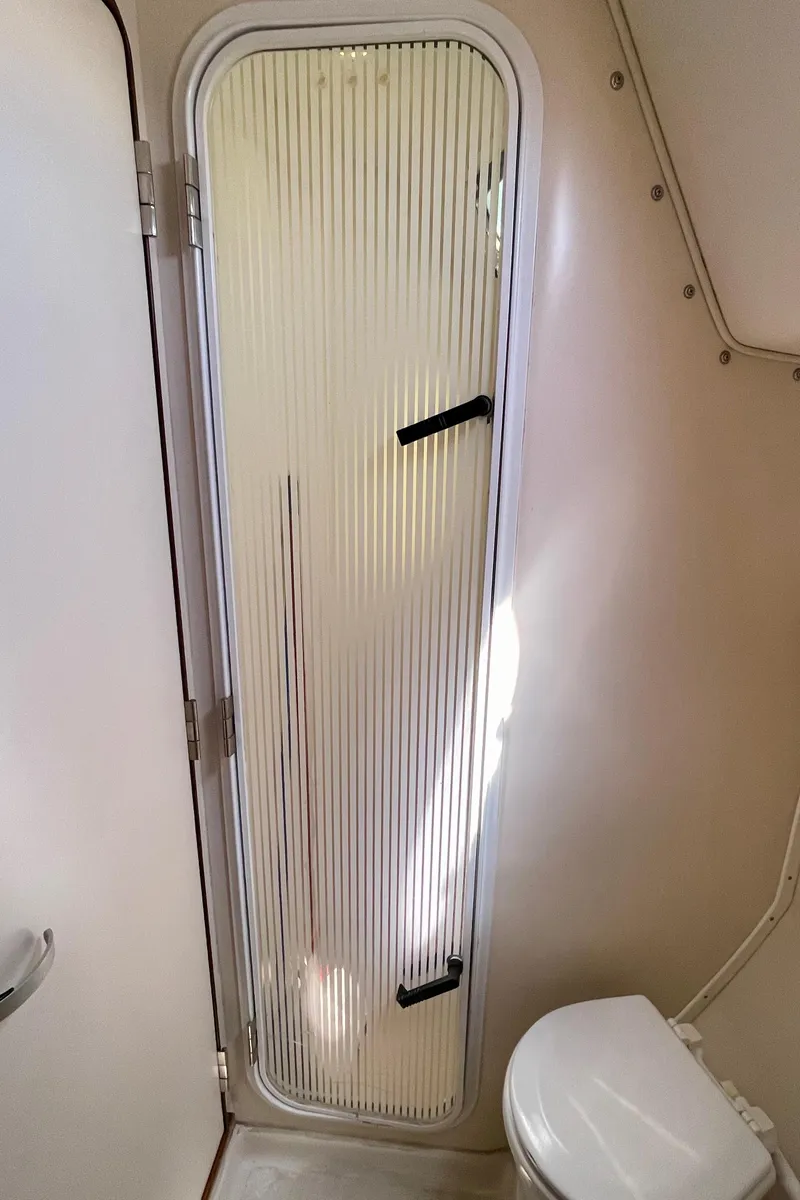 Slide: The Image of Catalina 380 yacht bathroom with shower door, 2001 model. - 48
