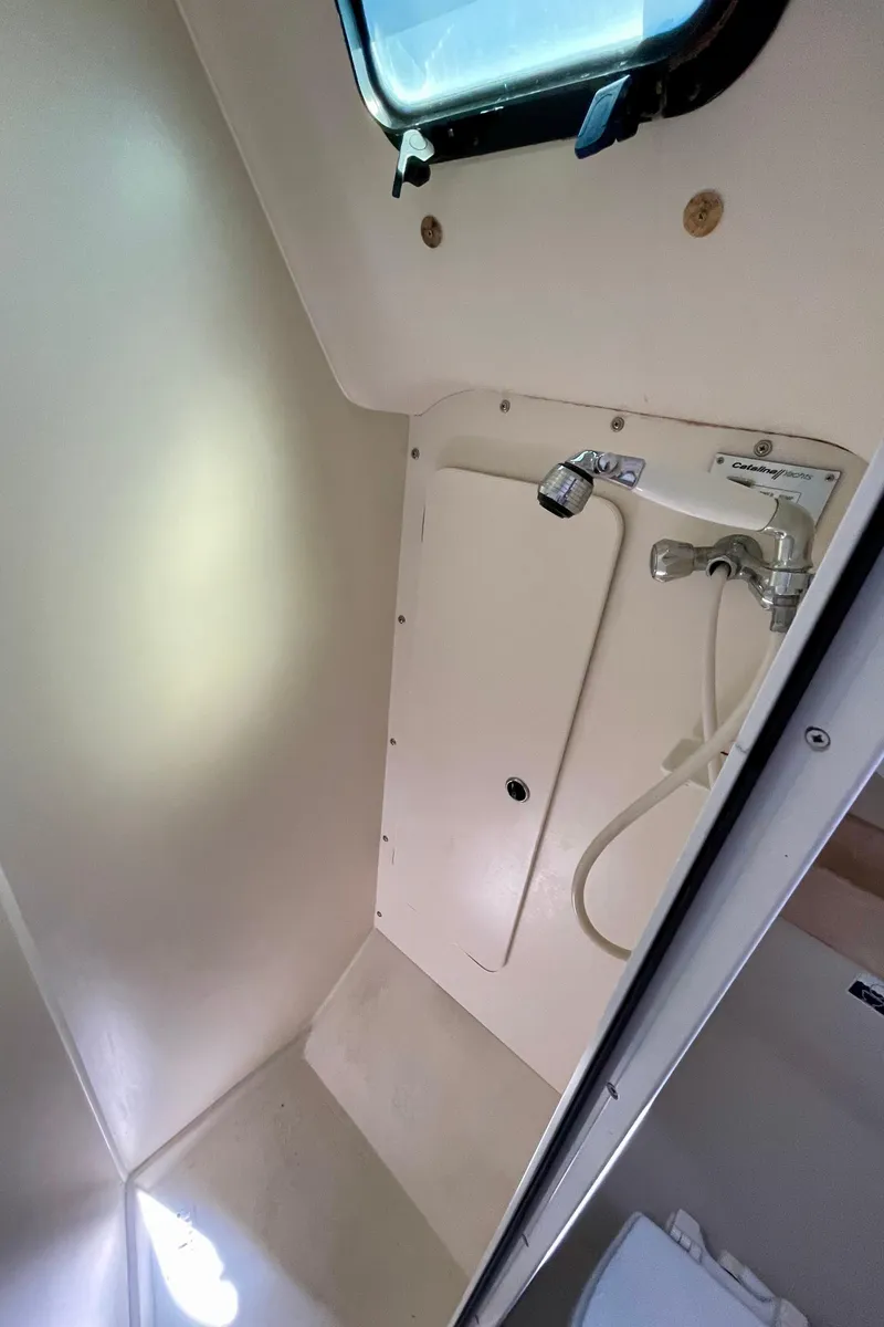 Slide: The Image of Catalina 380 2001 boat bathroom with showerhead and window. - 49