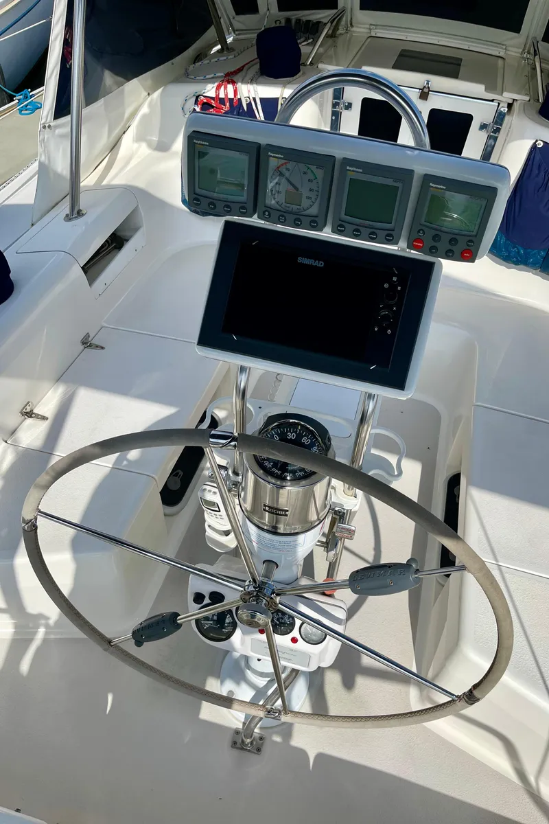 Slide: The Image of Steering wheel and navigation instruments on a 2001 Catalina 380 sailboat. - 8