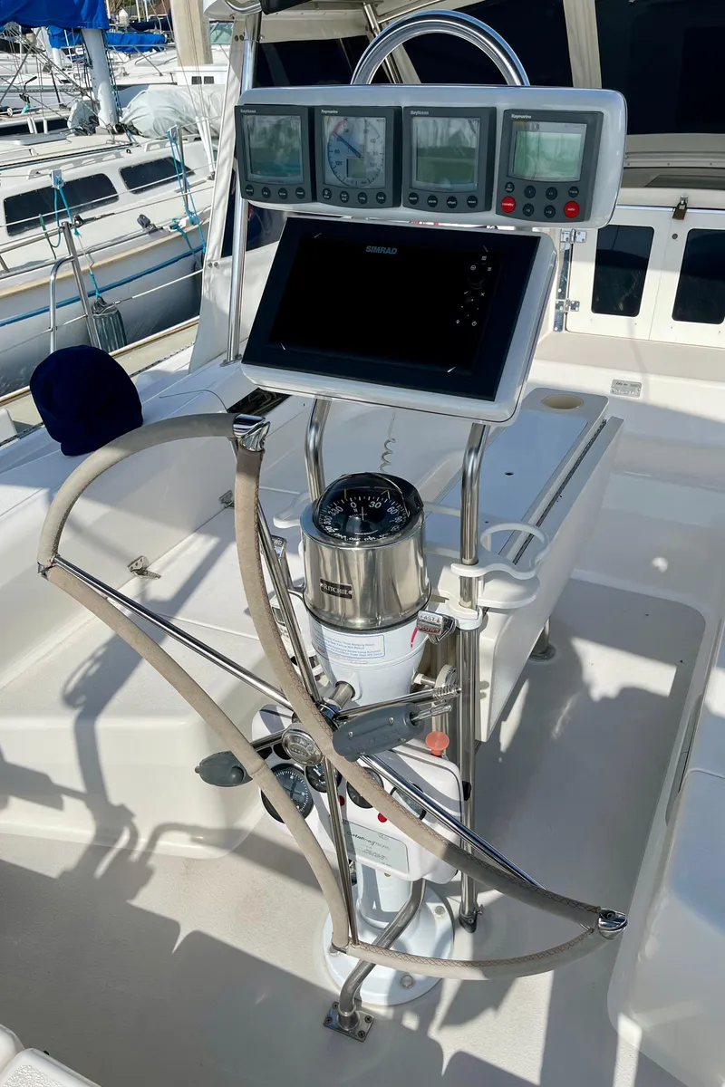 Slide: The Image of Cockpit of 2001 Catalina 380 sailboat with navigation instruments and steering wheel. - 9