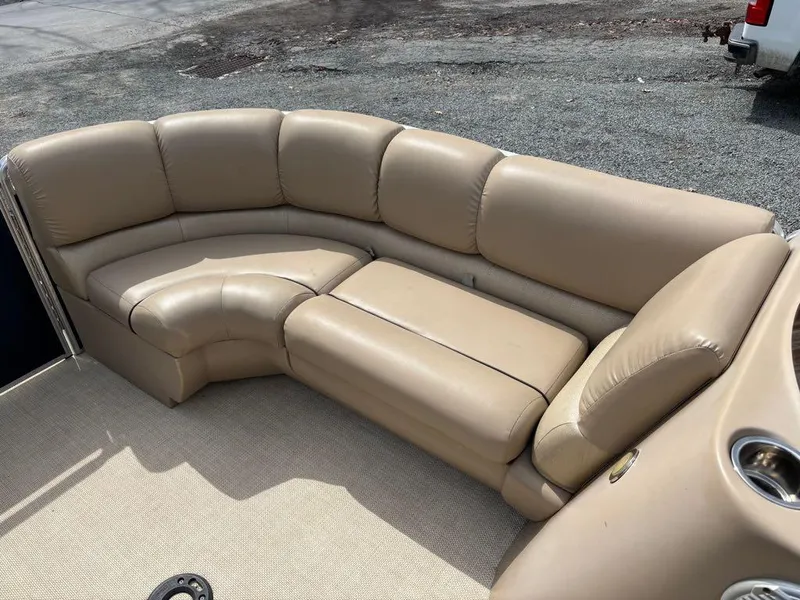 Slide: The Image of 2014 Harris Cruiser 220 pontoon boat with beige seating and carpeted floor. - 3