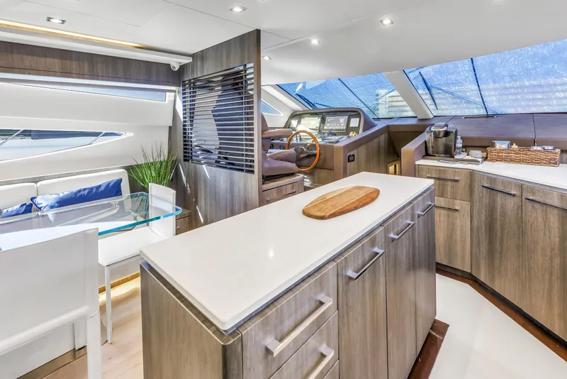 Slide: The Image of Luxurious interior of 2009 Uniesse 65 MY yacht with modern kitchen and seating area. - 21