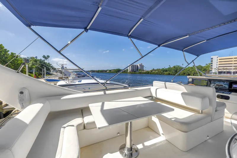 Slide: The Image of Luxury seating area on 2009 Uniesse 65 MY yacht with waterfront view. - 31