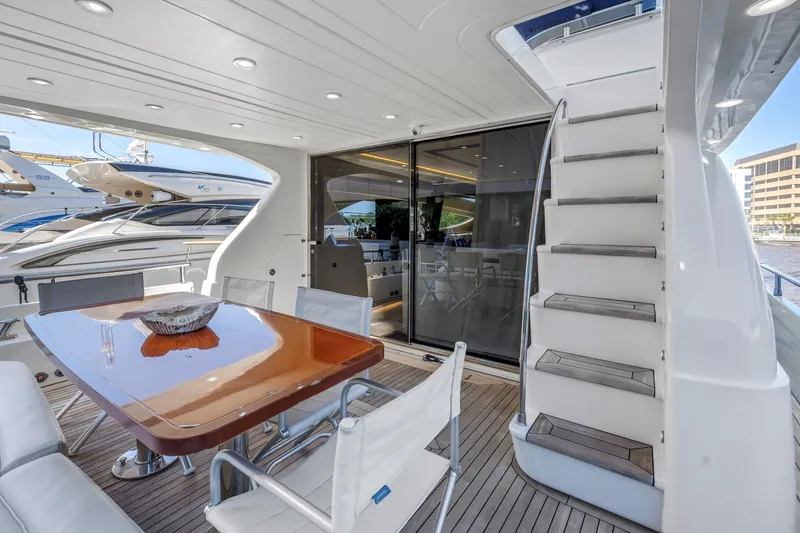 Slide: The Image of Luxury yacht Uniesse 65 MY 2009 with elegant outdoor dining area and staircase. - 39