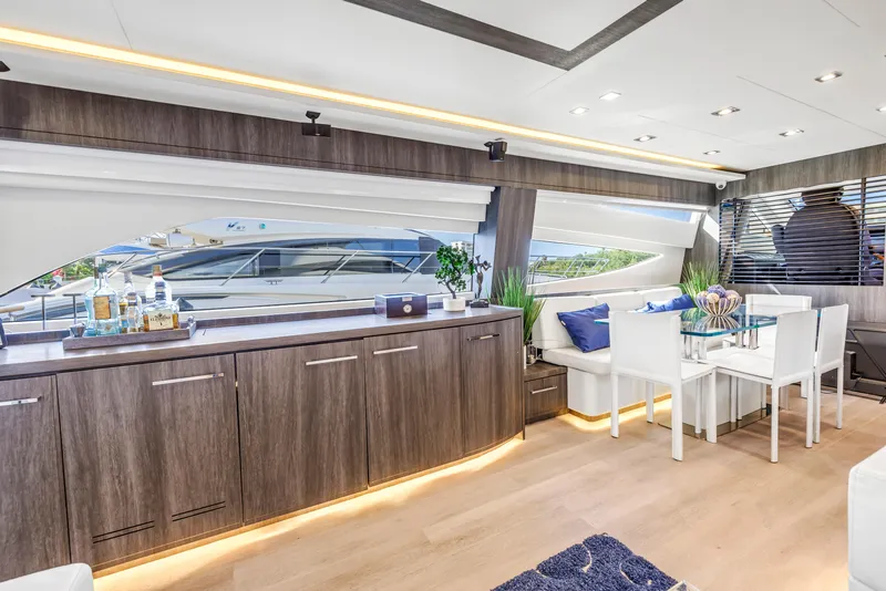 Slide: The Image of Luxurious interior of 2009 Uniesse 65 MY yacht with modern dining area and elegant decor. - 8