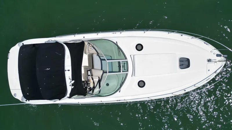 Slide: The Image of Overhead view of 2003 Sea Ray 340 Sundancer boat on water. - 11