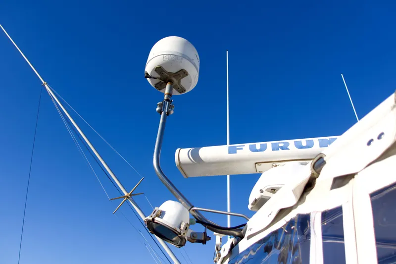 Slide: The Image of Radar equipment on a 1986 Bertram 46 Sportfisher against a clear blue sky. - 11