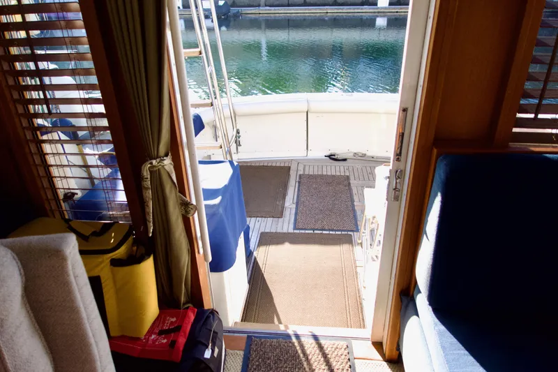 Slide: The Image of Interior view of 1986 Bertram 46 Sportfisher yacht, showing open cabin door to deck. - 17