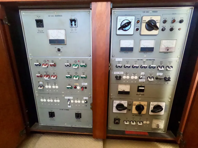 Slide: The Image of Electrical control panel on 1986 Bertram 46 Sportfisher boat, featuring switches and gauges. - 24