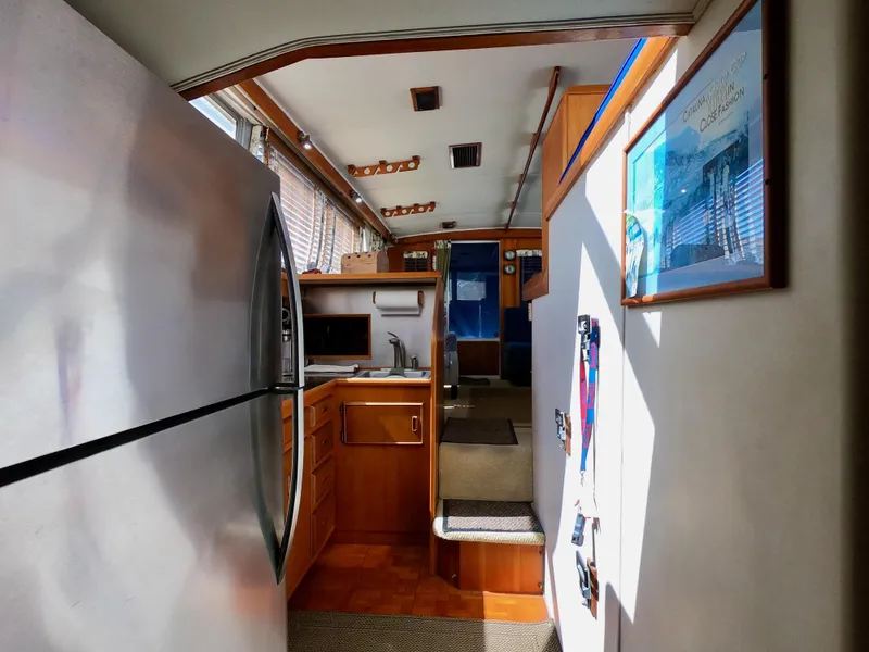 Slide: The Image of Interior of 1986 Bertram 46 Sportfisher yacht with kitchen and modern appliances. - 28