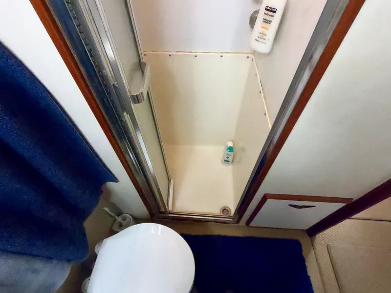 Slide: The Image of Bathroom interior of 1986 Bertram 46 Sportfisher with shower and toilet. - 32