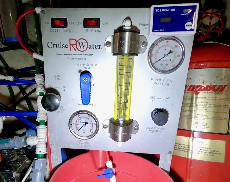 Slide: The Image of 1986 Bertram 46 Sportfisher water filtration system with gauges and controls. - 42