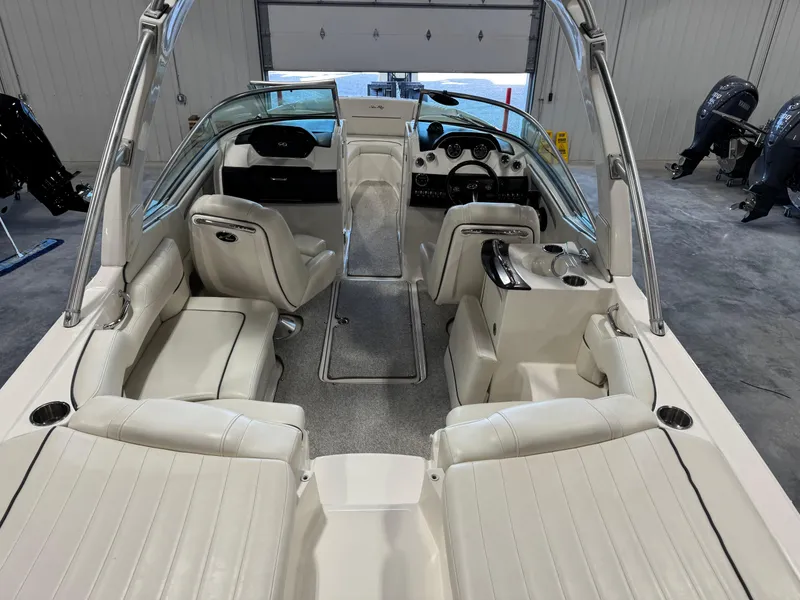 Slide: The Image of 2007 Sea Ray 250 SLX boat interior with white seating and sleek design. - 10